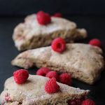 Raspberry scones on a black background.