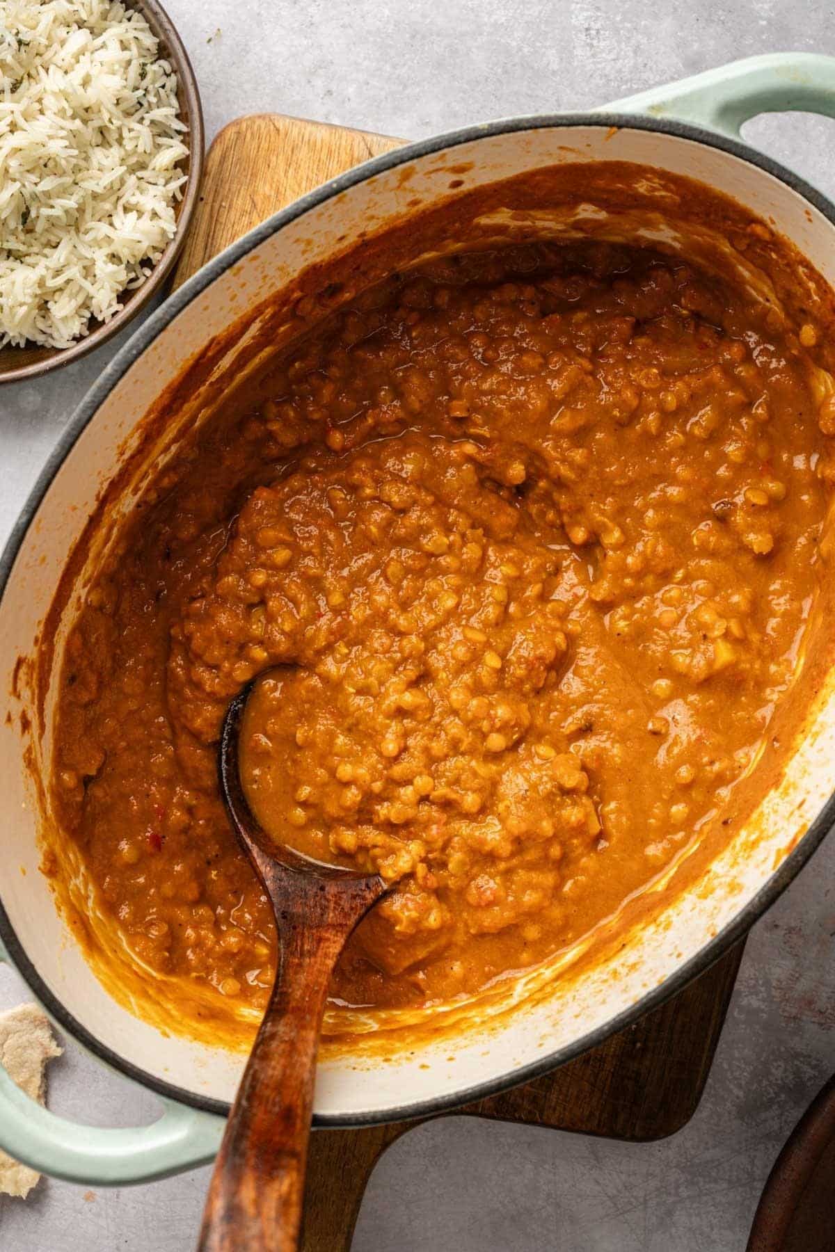 Cooked potato lentil tikka masala in a Dutch oven.