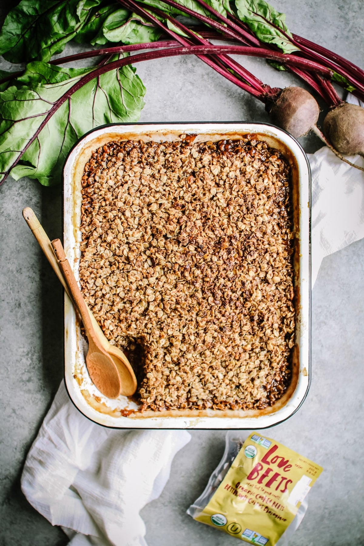 Enamel pan with apple crisp and fresh beets on the side. 