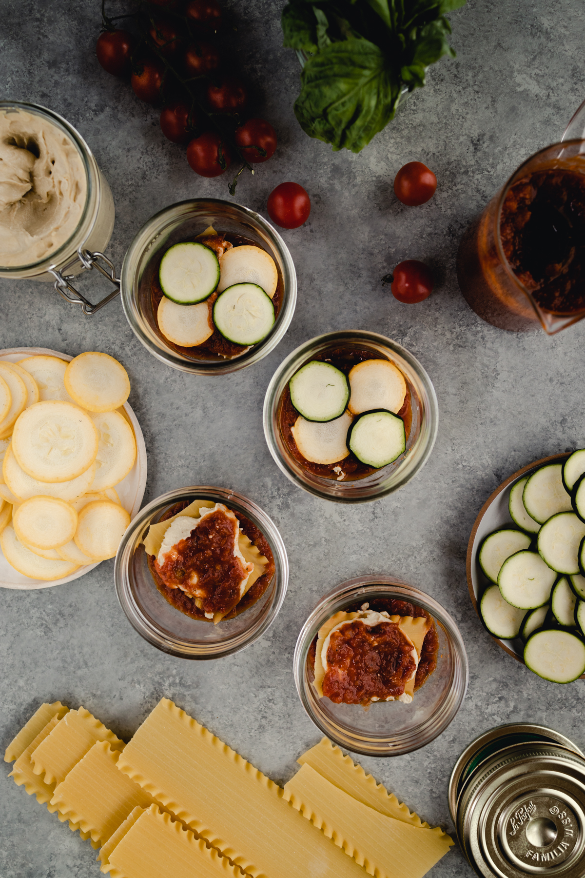 Step-by-step-photo of homemade mini lasagna made in a jar.