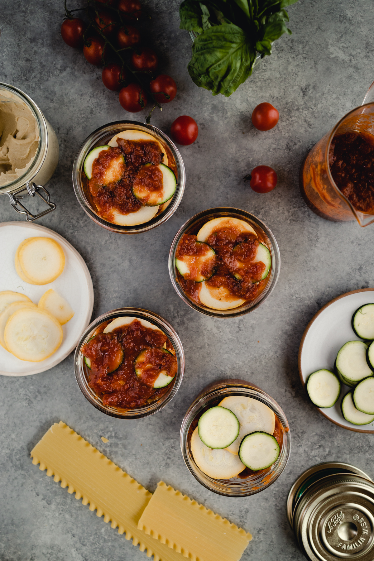 Step-by-step-photo of homemade mini lasagna made in a jar.