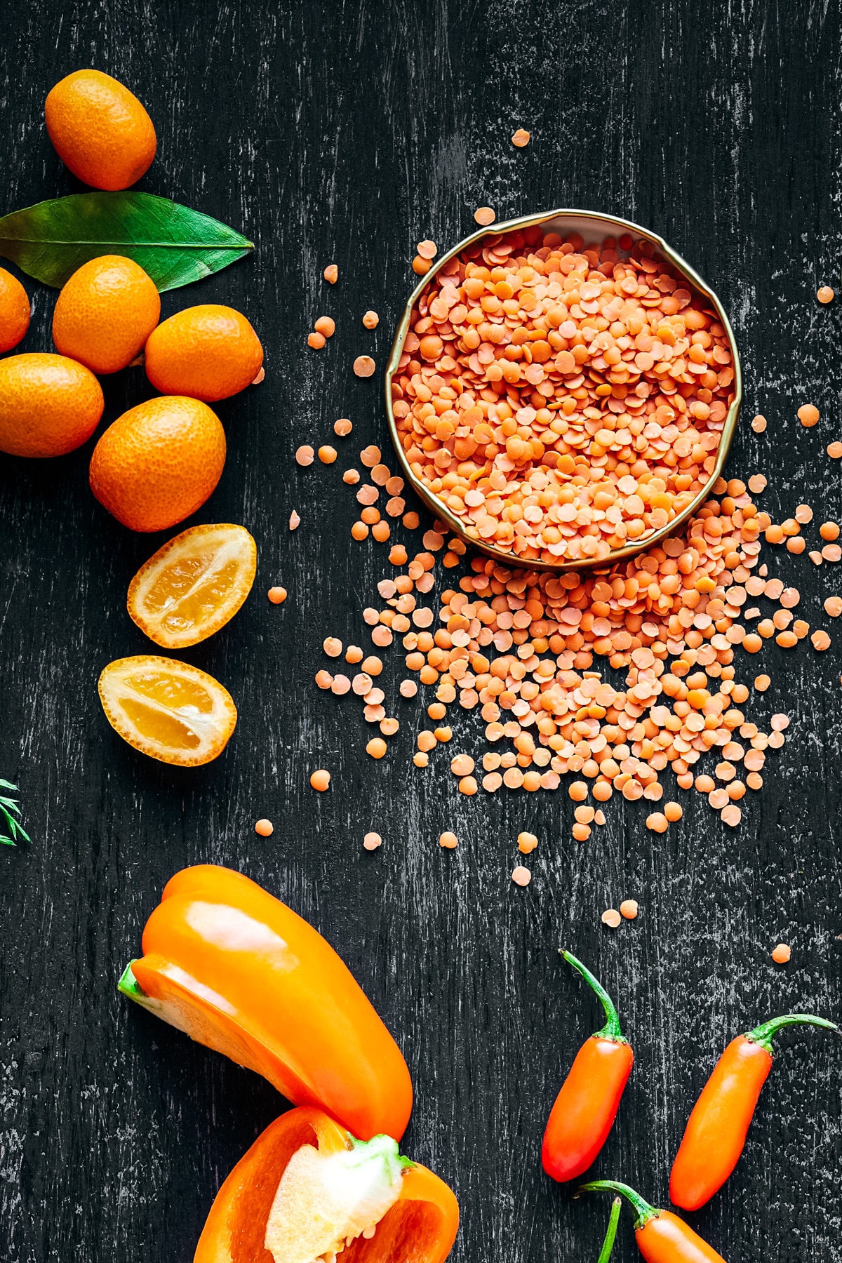 Orange lentils, bell peppers, and kumquats. 