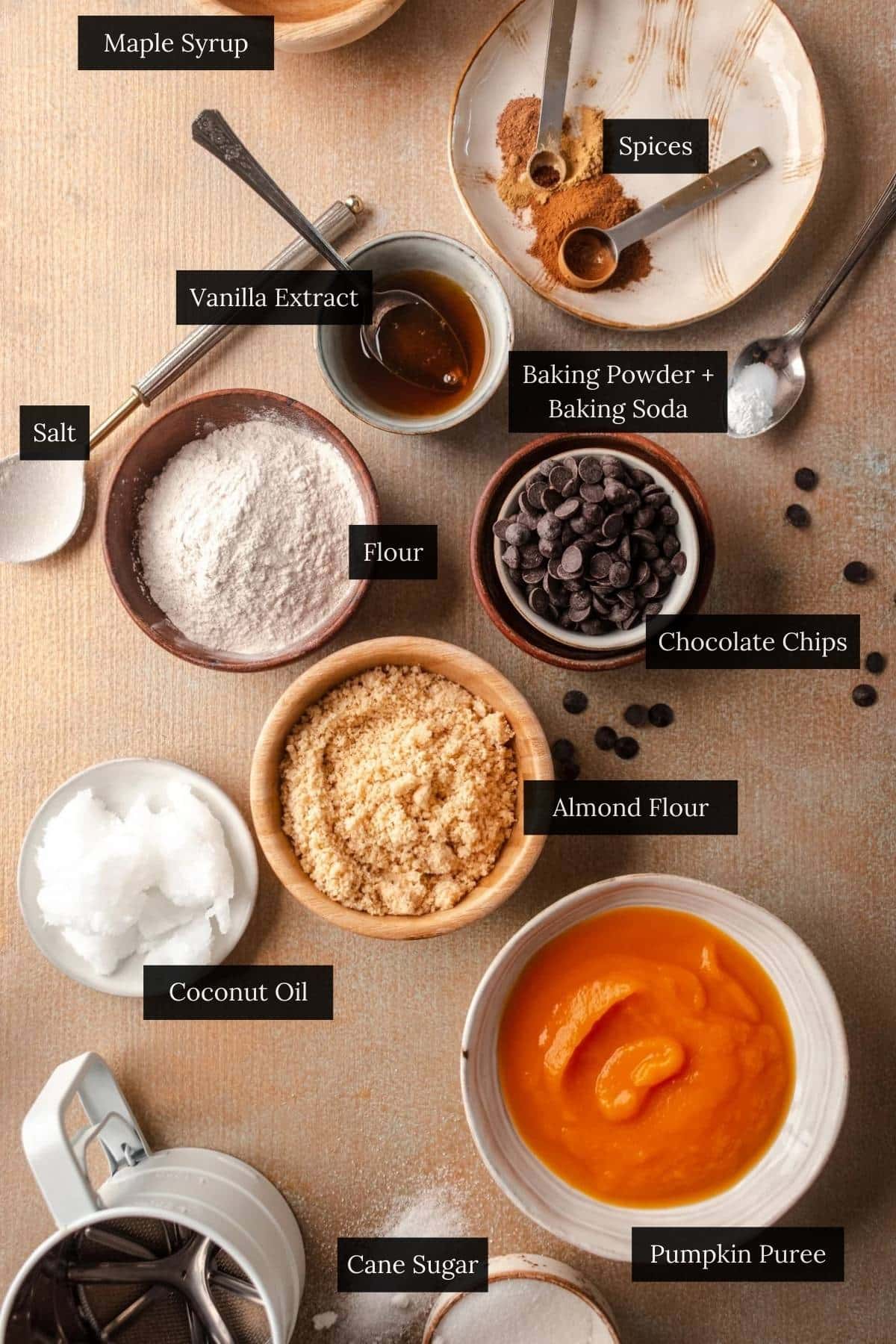 Small bowls of ingredients for pumpkin cookies.
