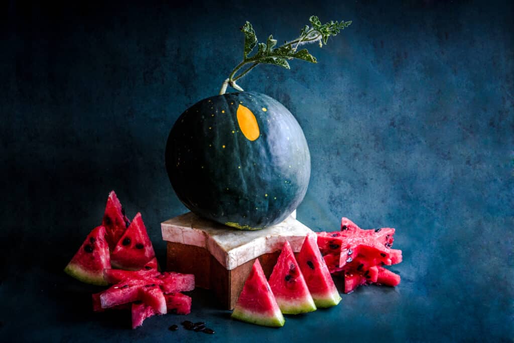 Moon and stars watermelon with dark green to black skin and bright red flesh.