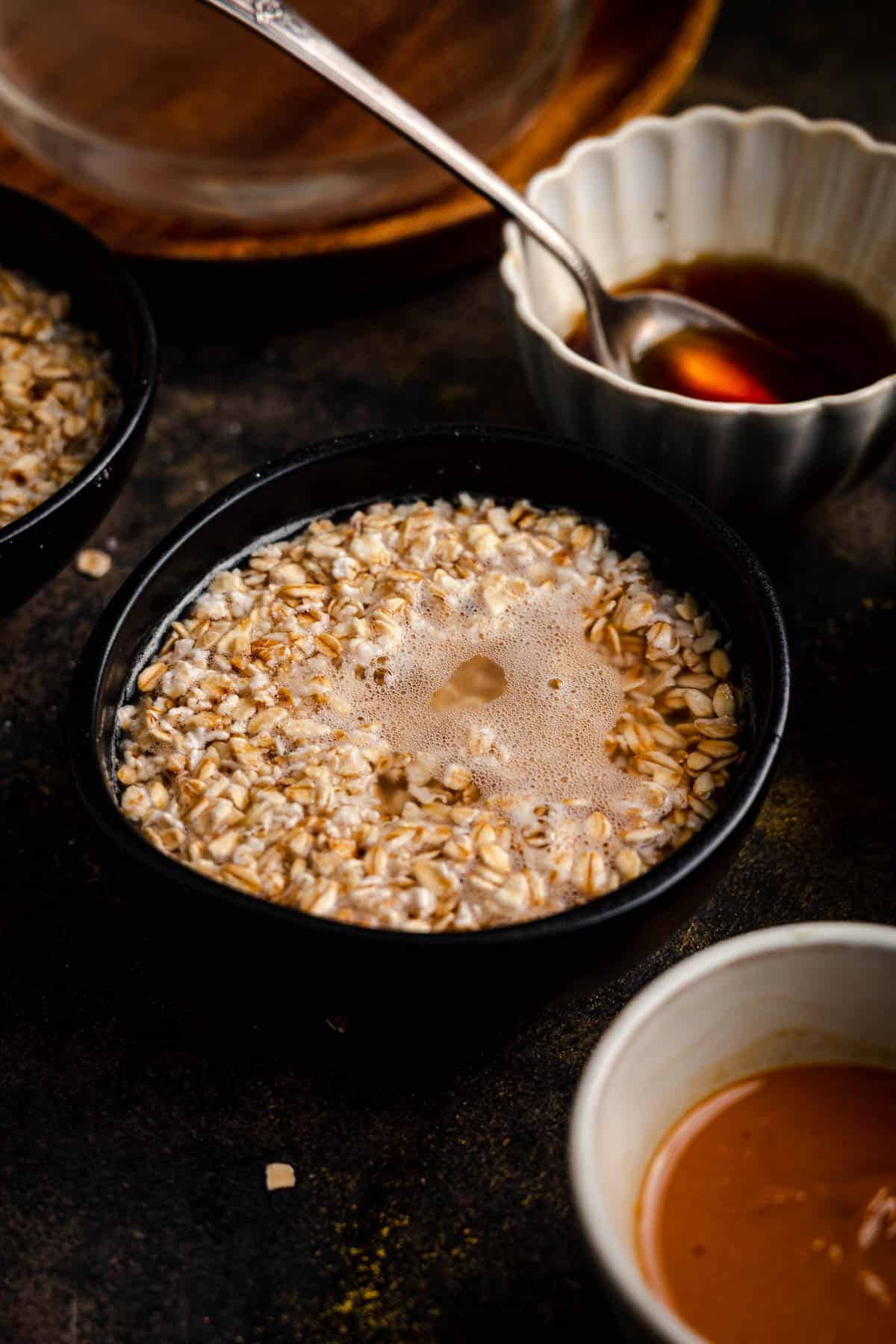 Hot water poured over a bowl of peanut butter oatmeal.