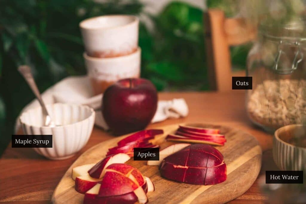 Table set with the ingredients for apple cinnamon oatmeal.