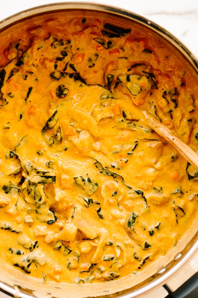 Large pot of sunshine yellow jackfruit stew.