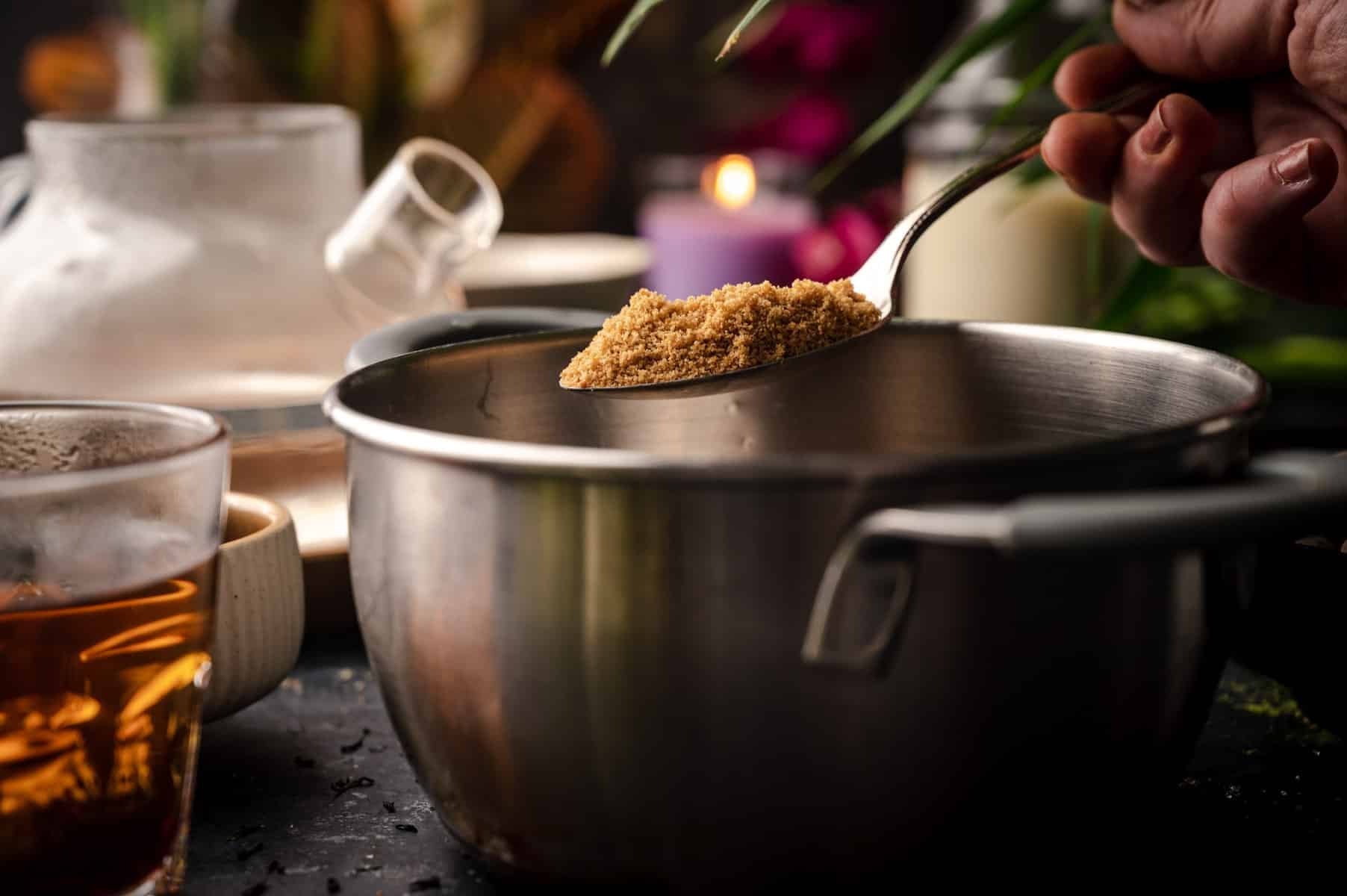 Brown sugar being added to tapioca pearls.