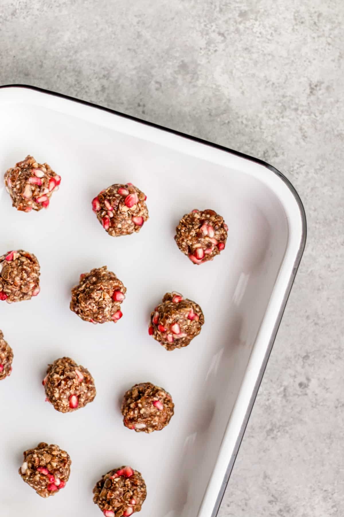 Enamel tray of pomegranate oat balls.