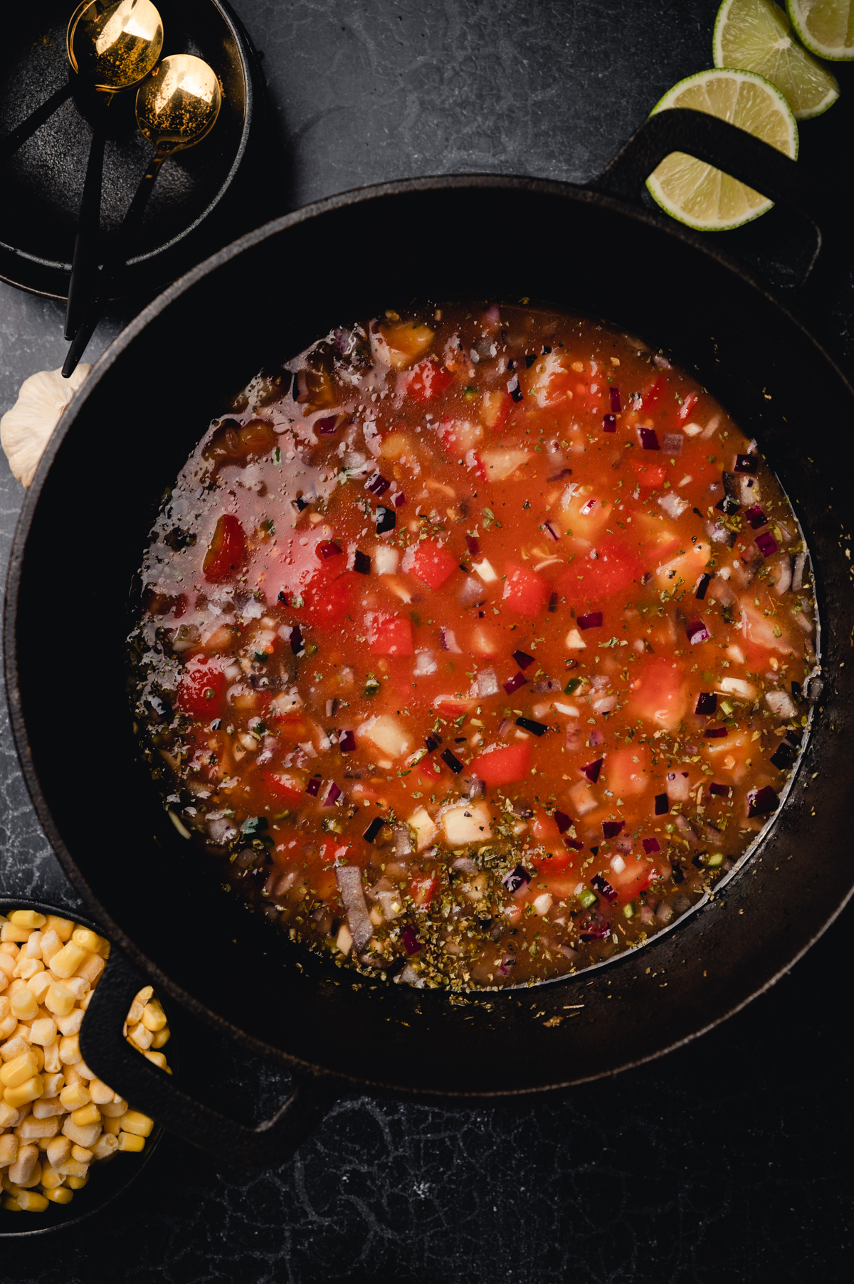 Ingredients for vegan chili cooking in a large pot.