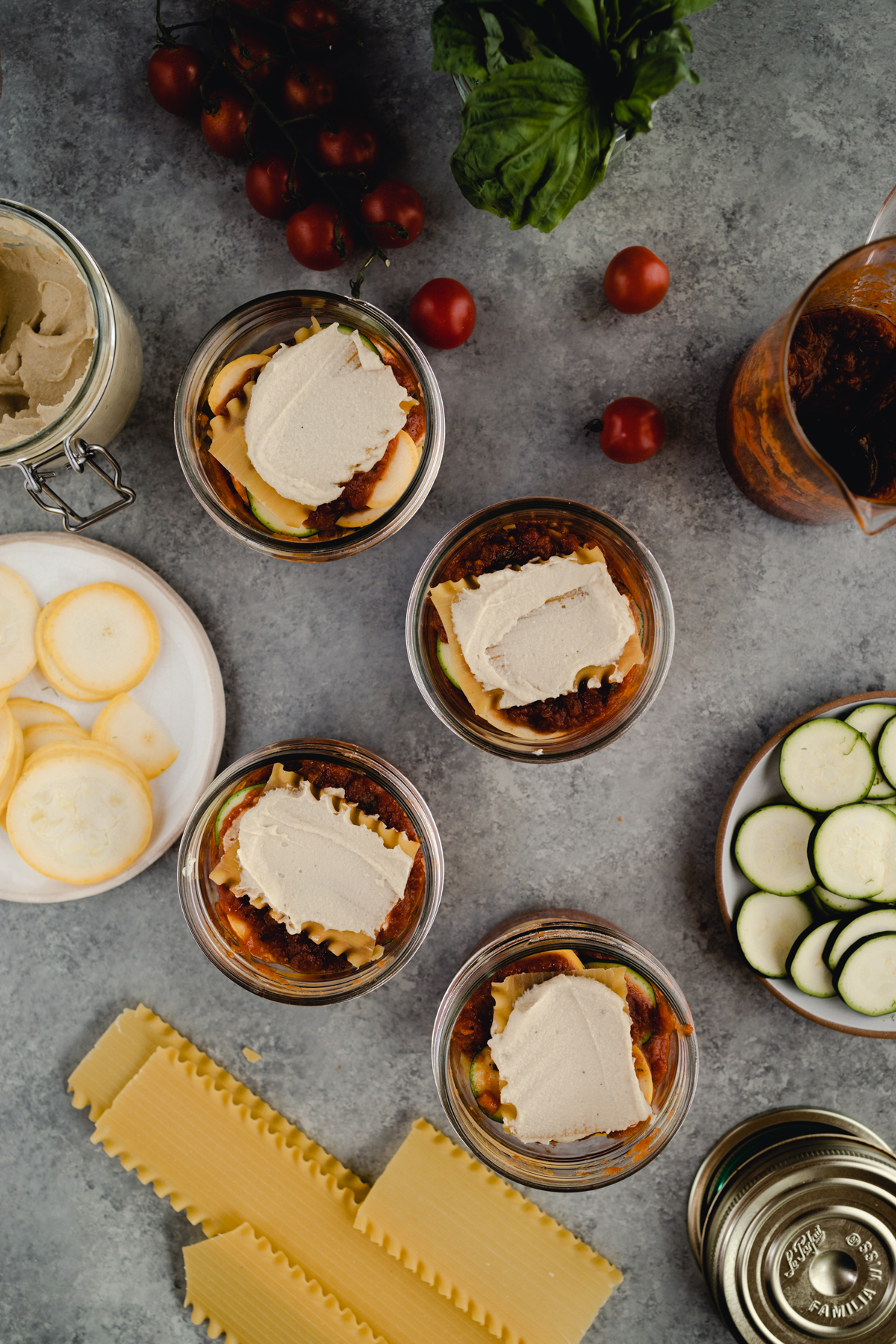 Step-by-step-photo of homemade mini lasagna made in a jar.