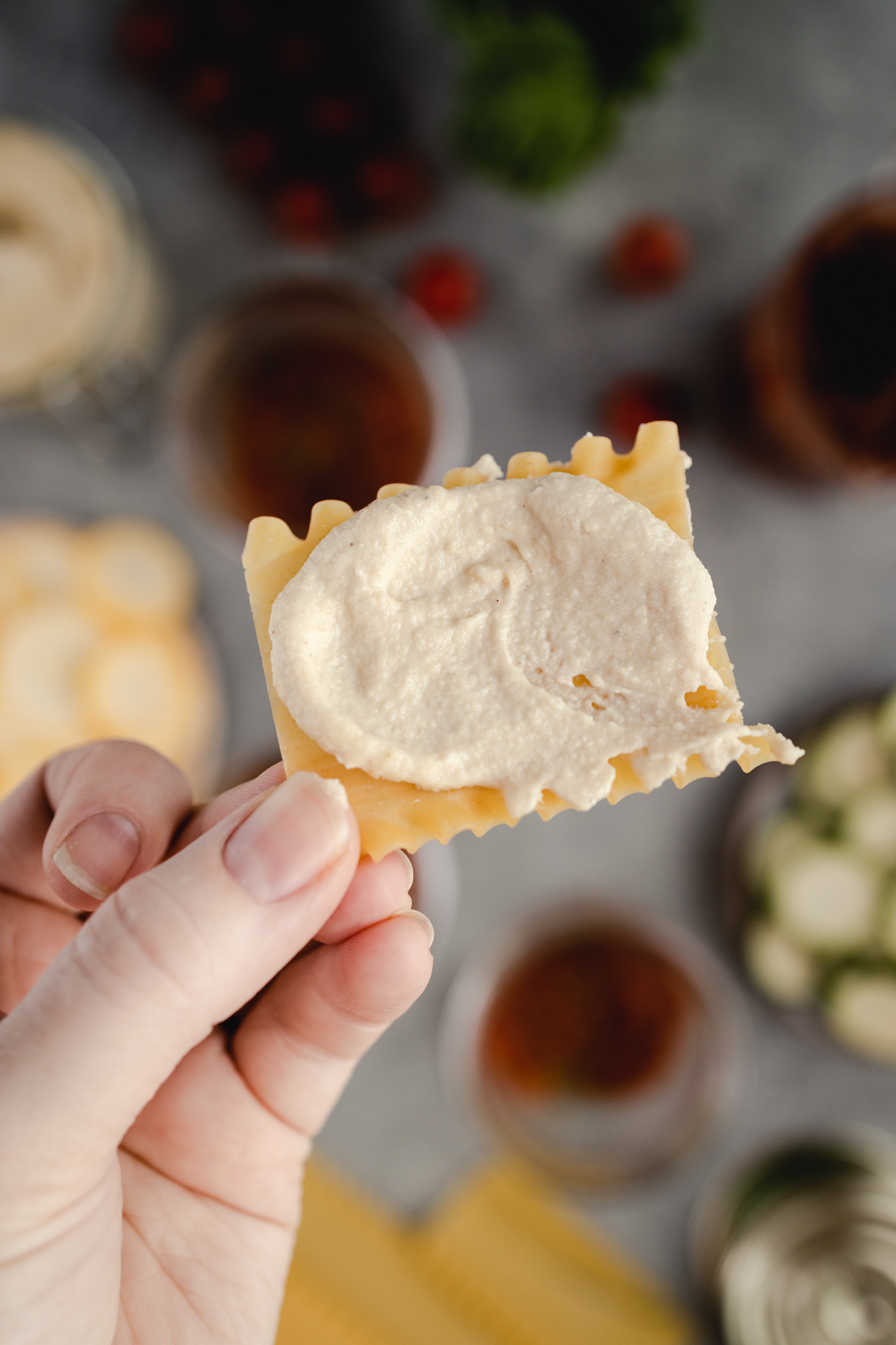 Lasagna noodle covered in cashew ricotta cheese.