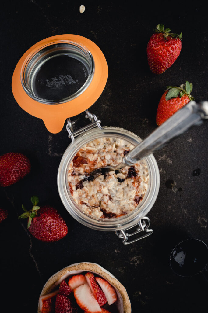 Overnight oats with peanut butter and jelly stirred in.