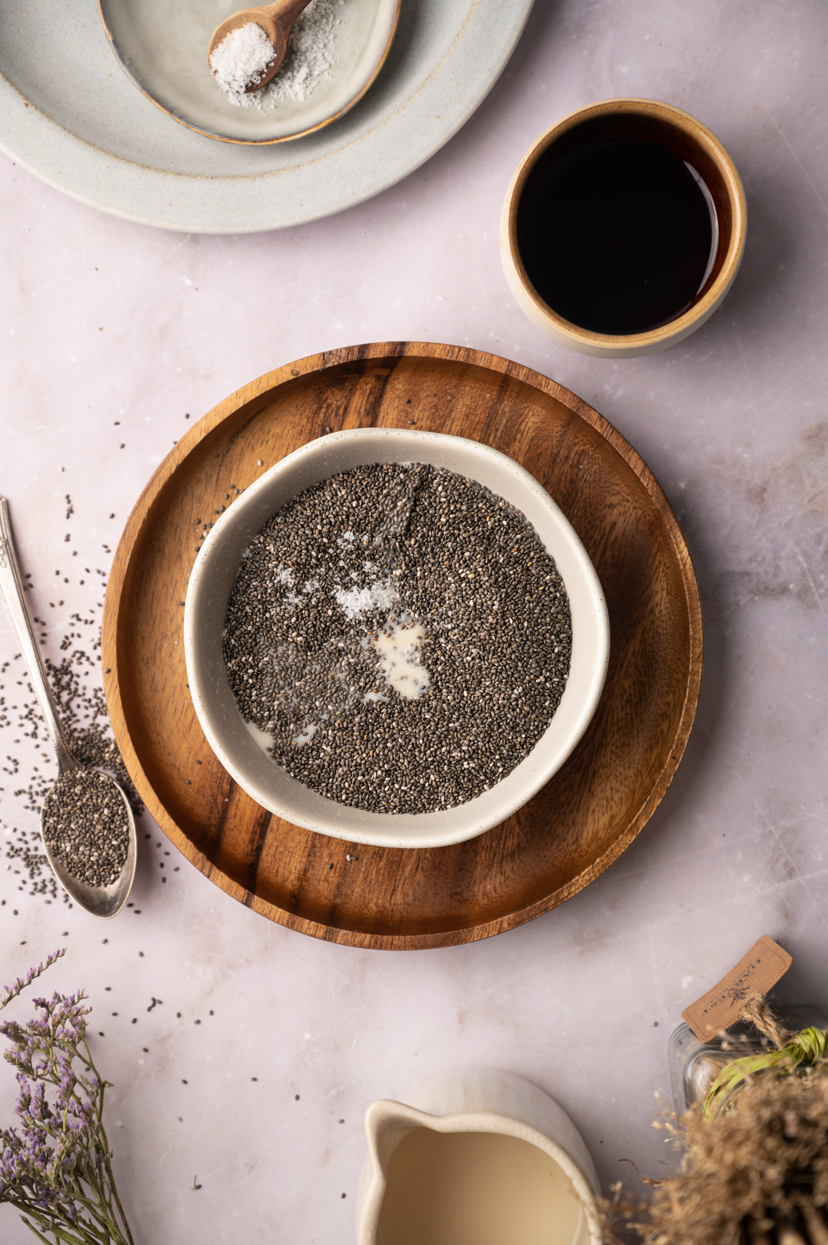 Chia seeds in a bowl on a plate.