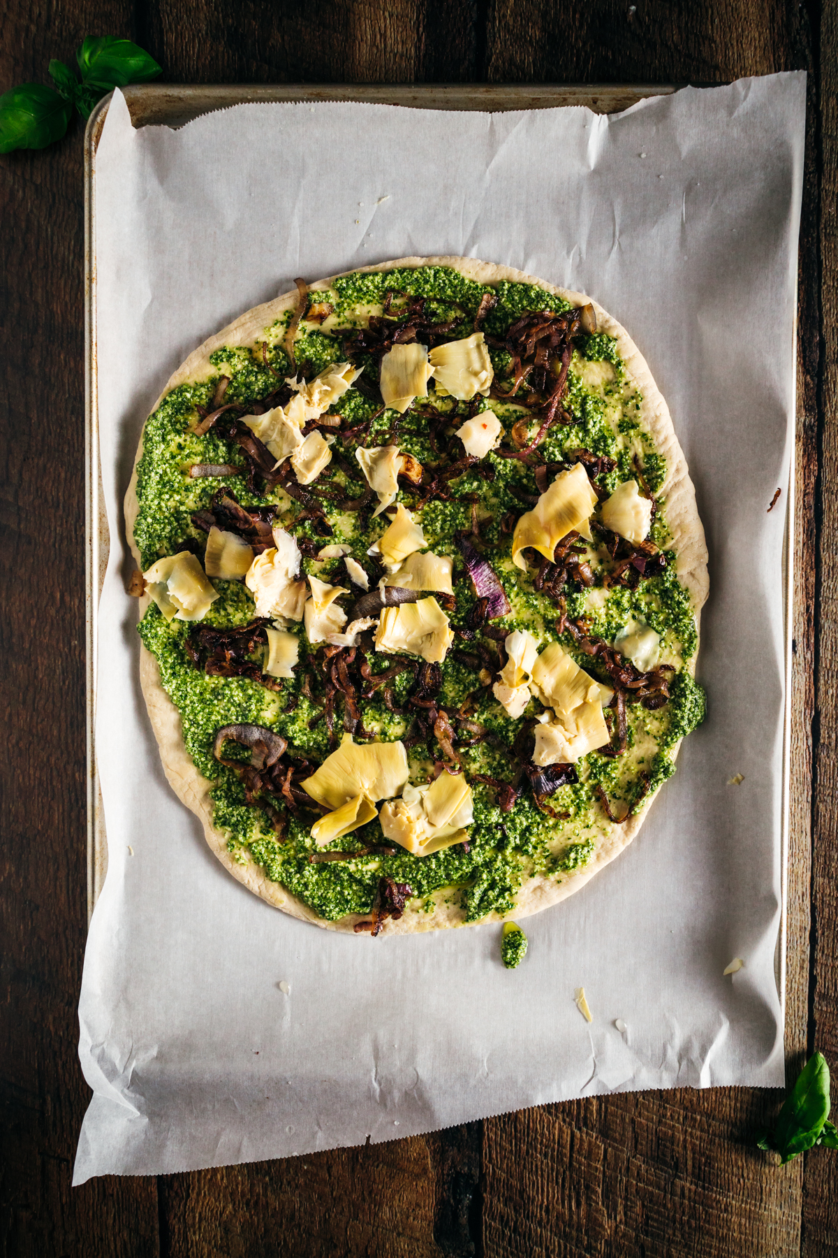 A pizza is sitting on top of a piece of paper.