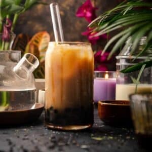 Glass of brown sugar bubble tea with brown sugar syrup dripping down the glass.