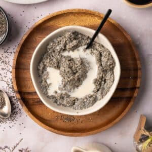 Bowl of homemade chia pudding on a wooden plate.