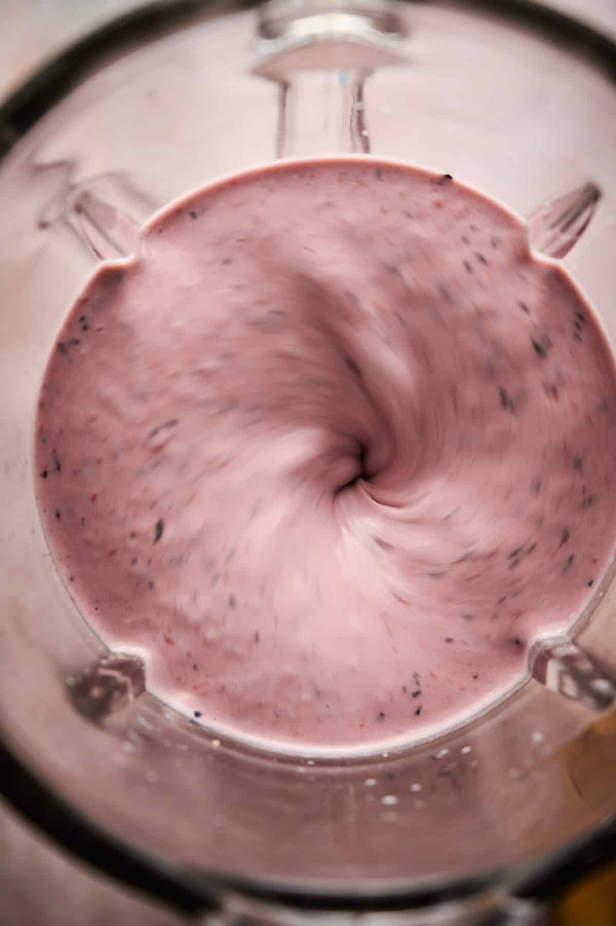 Step by step instructions for making blueberry raspberry smoothie.