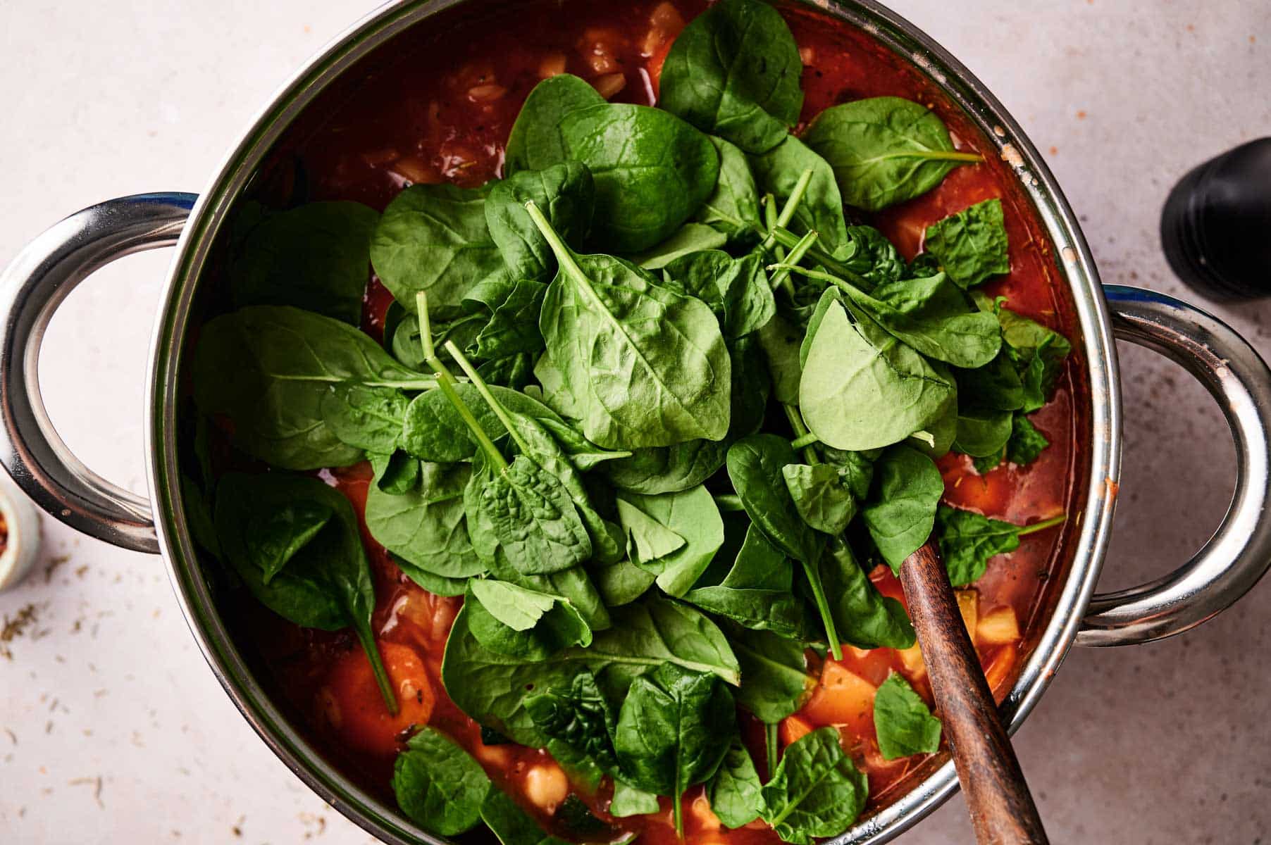 Spinach added to the veggie orzo soup.