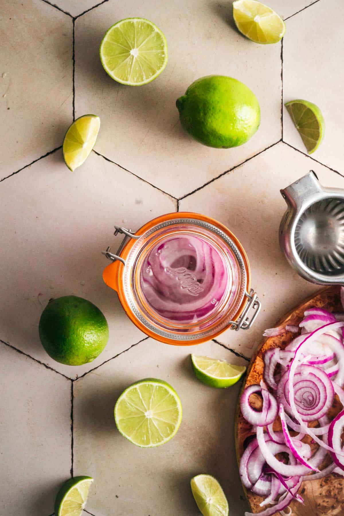 Closed glass jar with pickled onions in it.