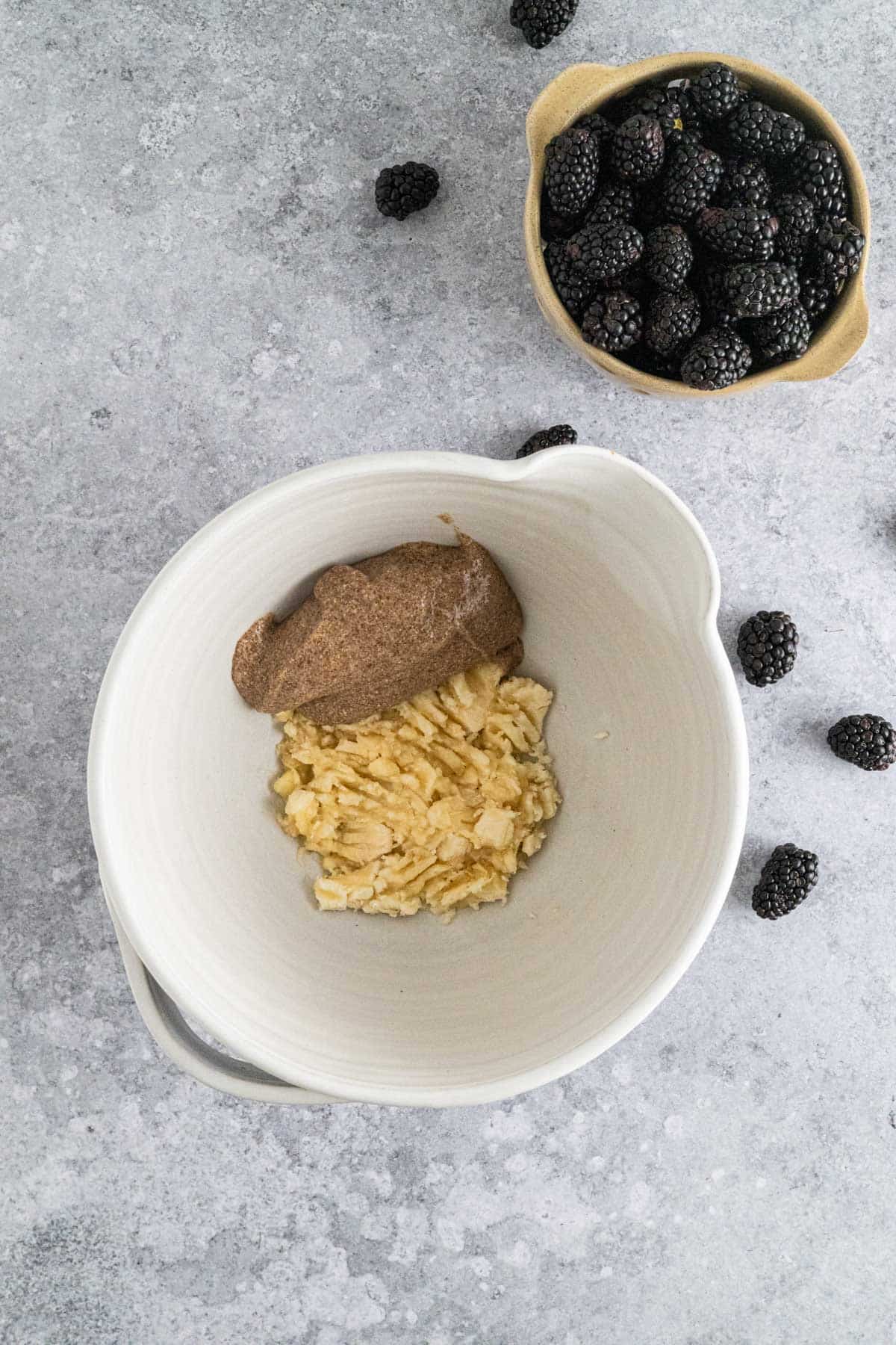 Adding flax egg and mashed banana to a large bowl.