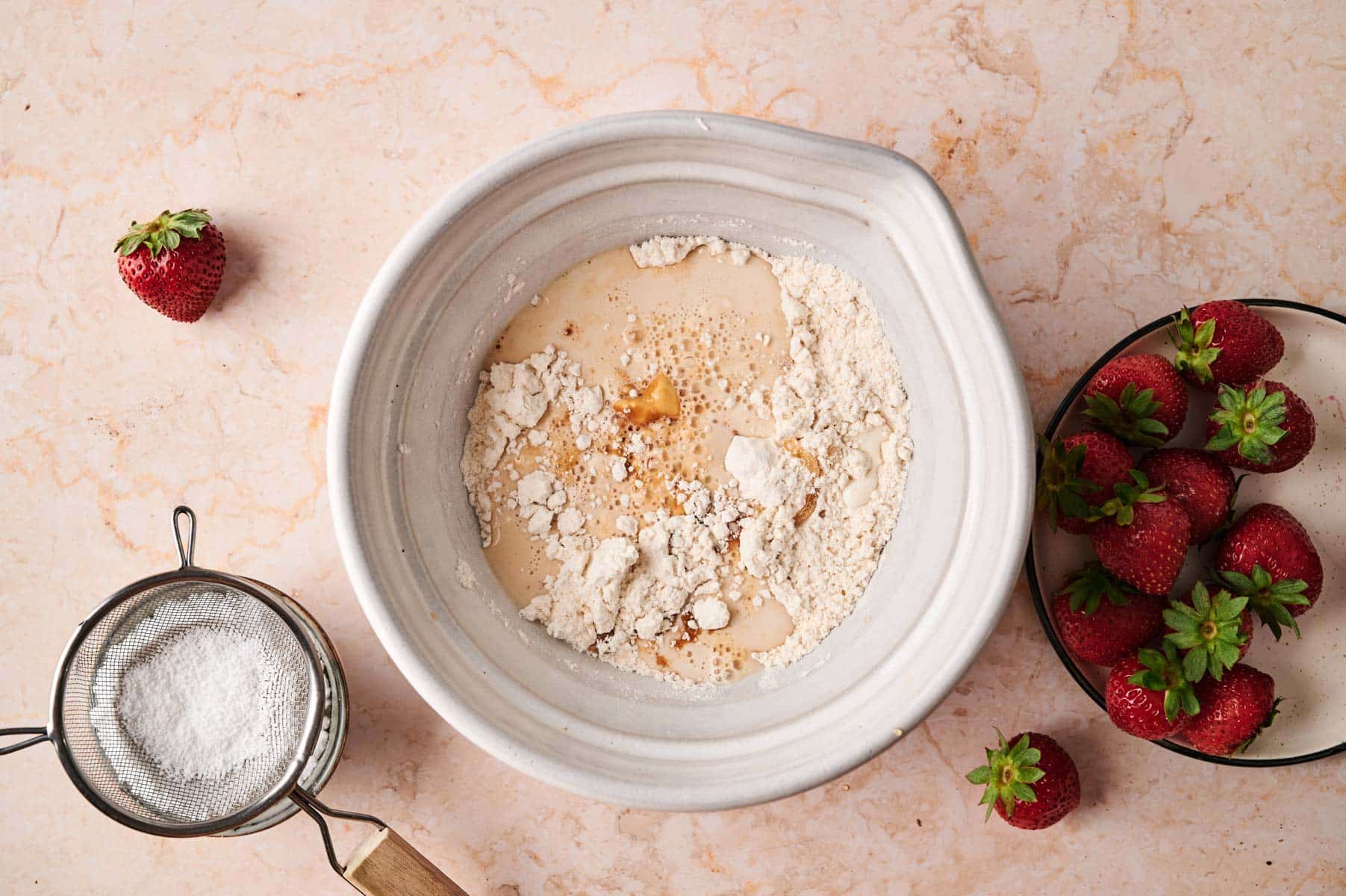 Mixing the ingredients for mini pancakes.