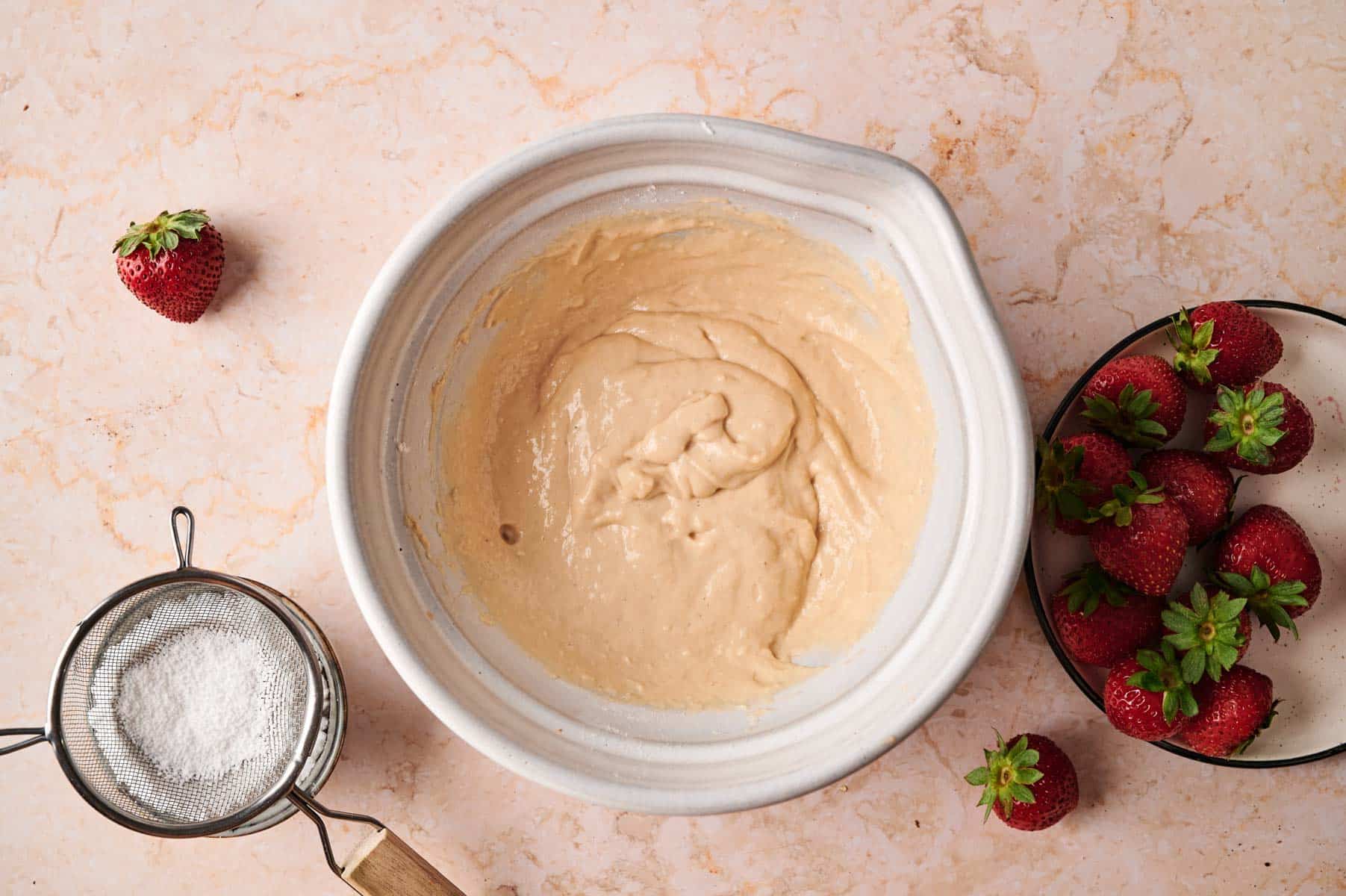 Mixing the ingredients for mini pancakes.