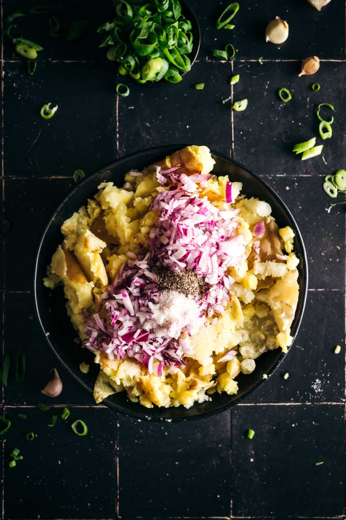 Salt and pepper added to the mashed potato mixture.