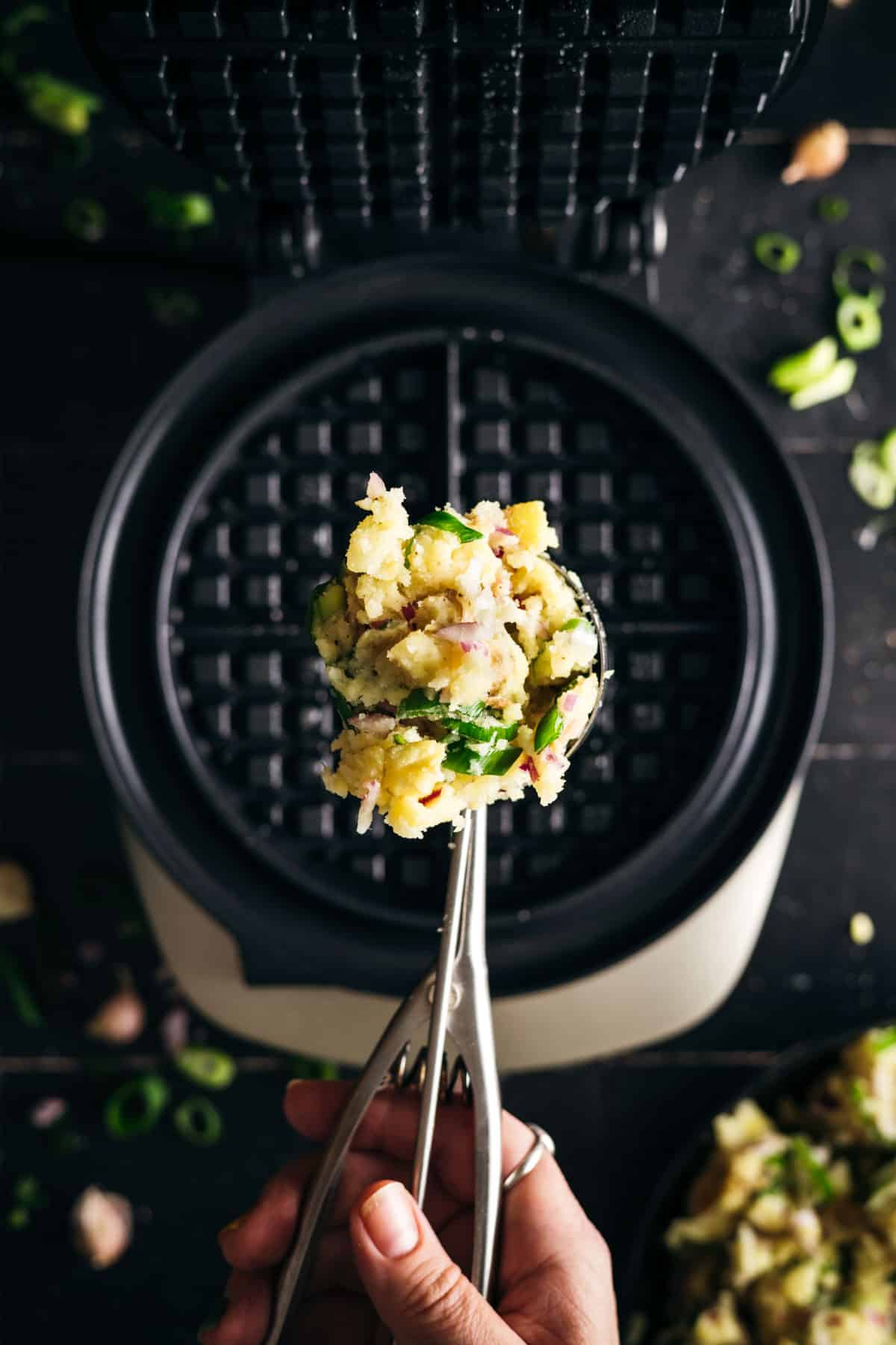 Scoop full of mashed potatoes.