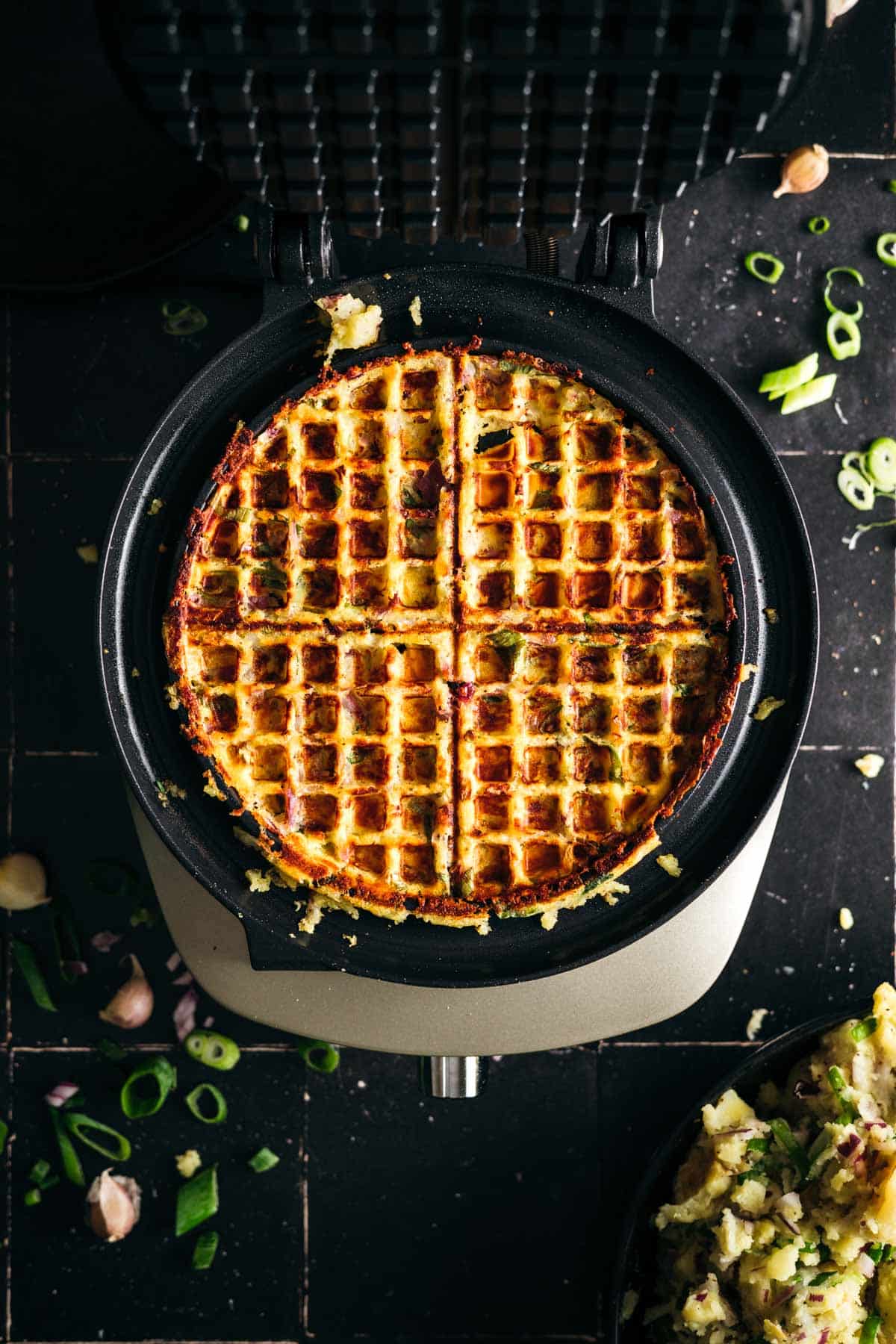 Cooked mashed potato waffle in the waffle iron.