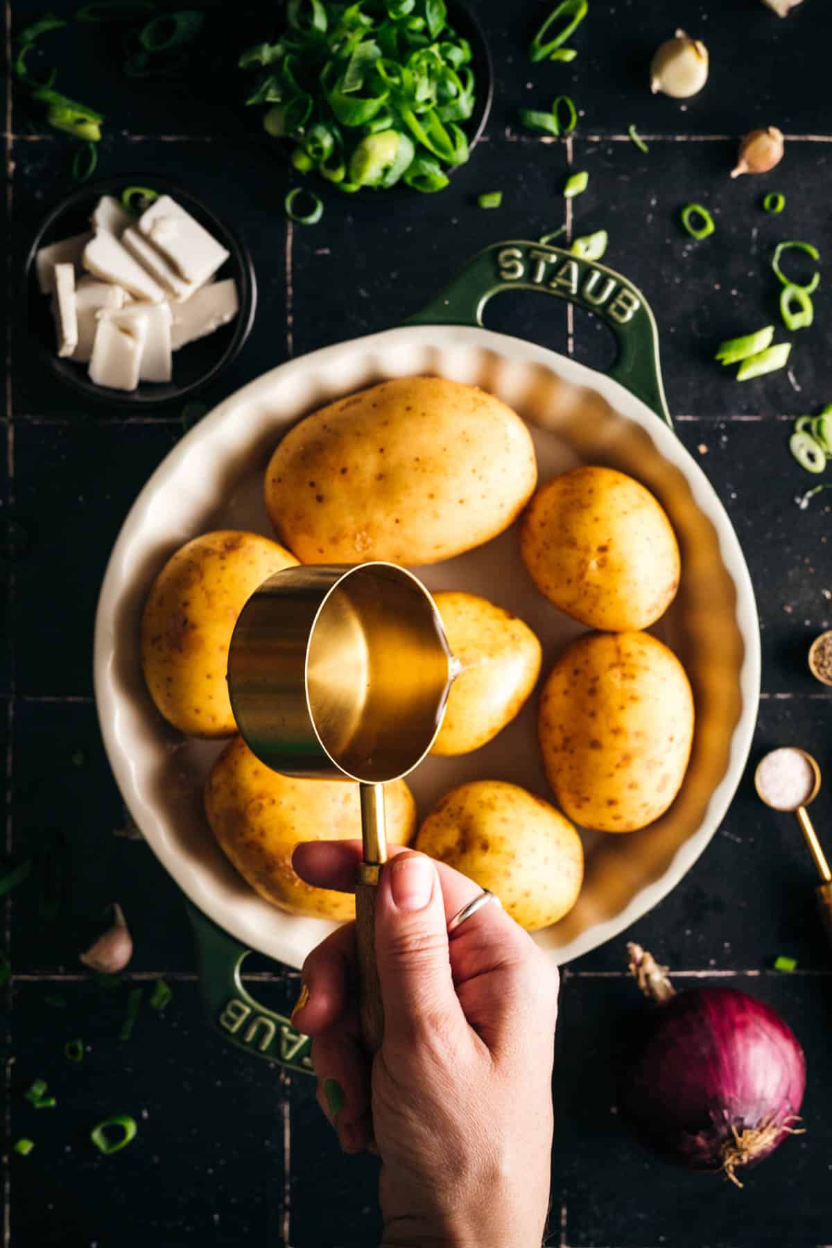 Preparing gold potatoes to be microwaved.