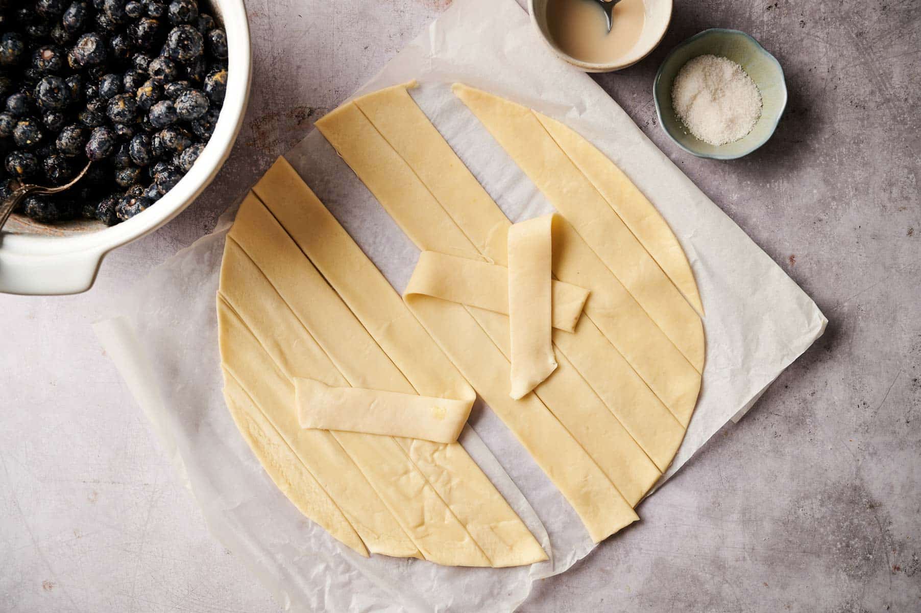 Preparing pie dough for berry pie.