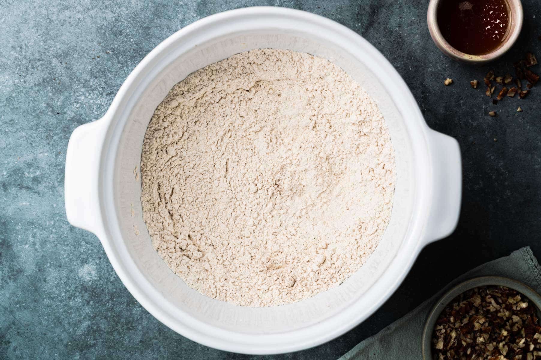 Dry ingredients for healthy banana scones in a large mixing bowl.