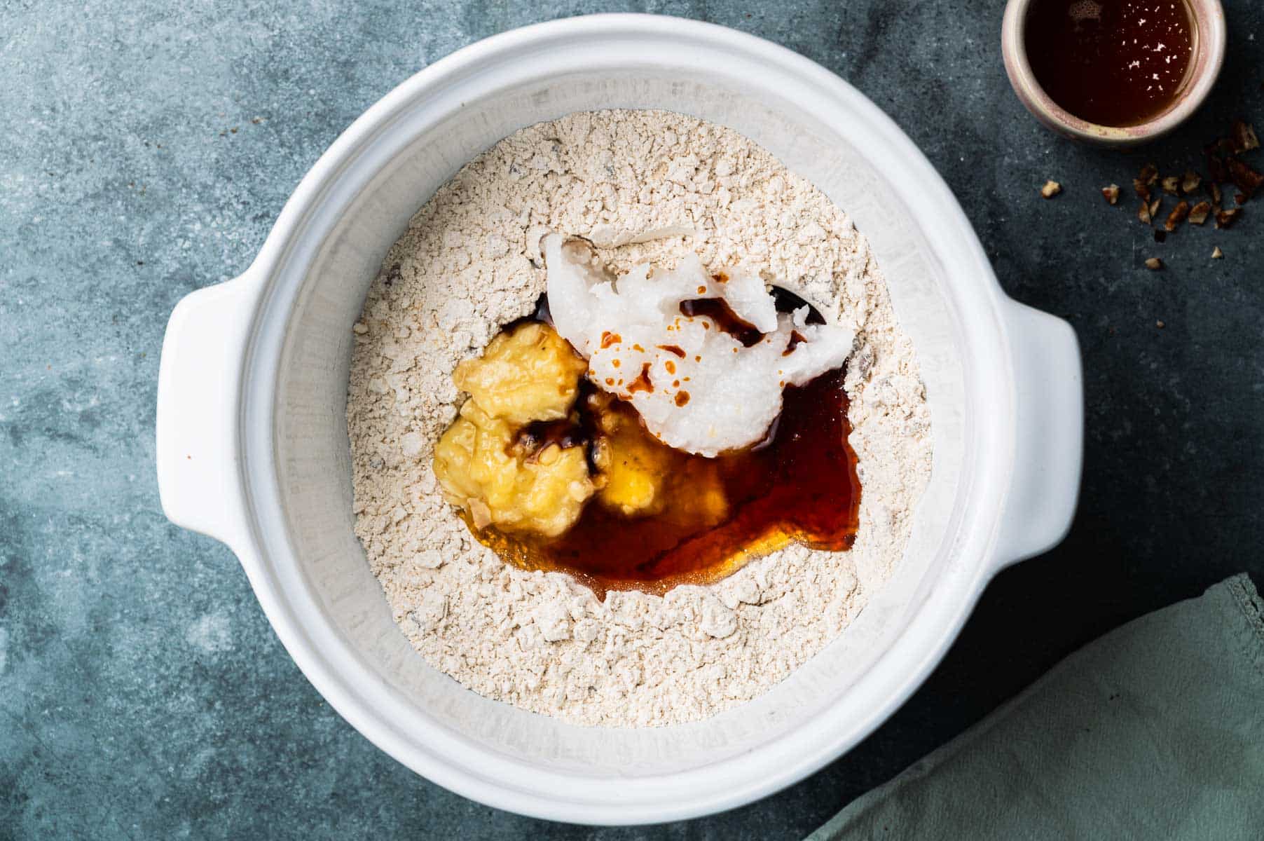 Wet ingredients added to a large mixing bowl.