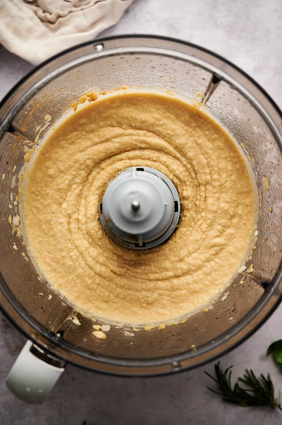 Ingredients for hummus without tahini in a food processor all blended up!