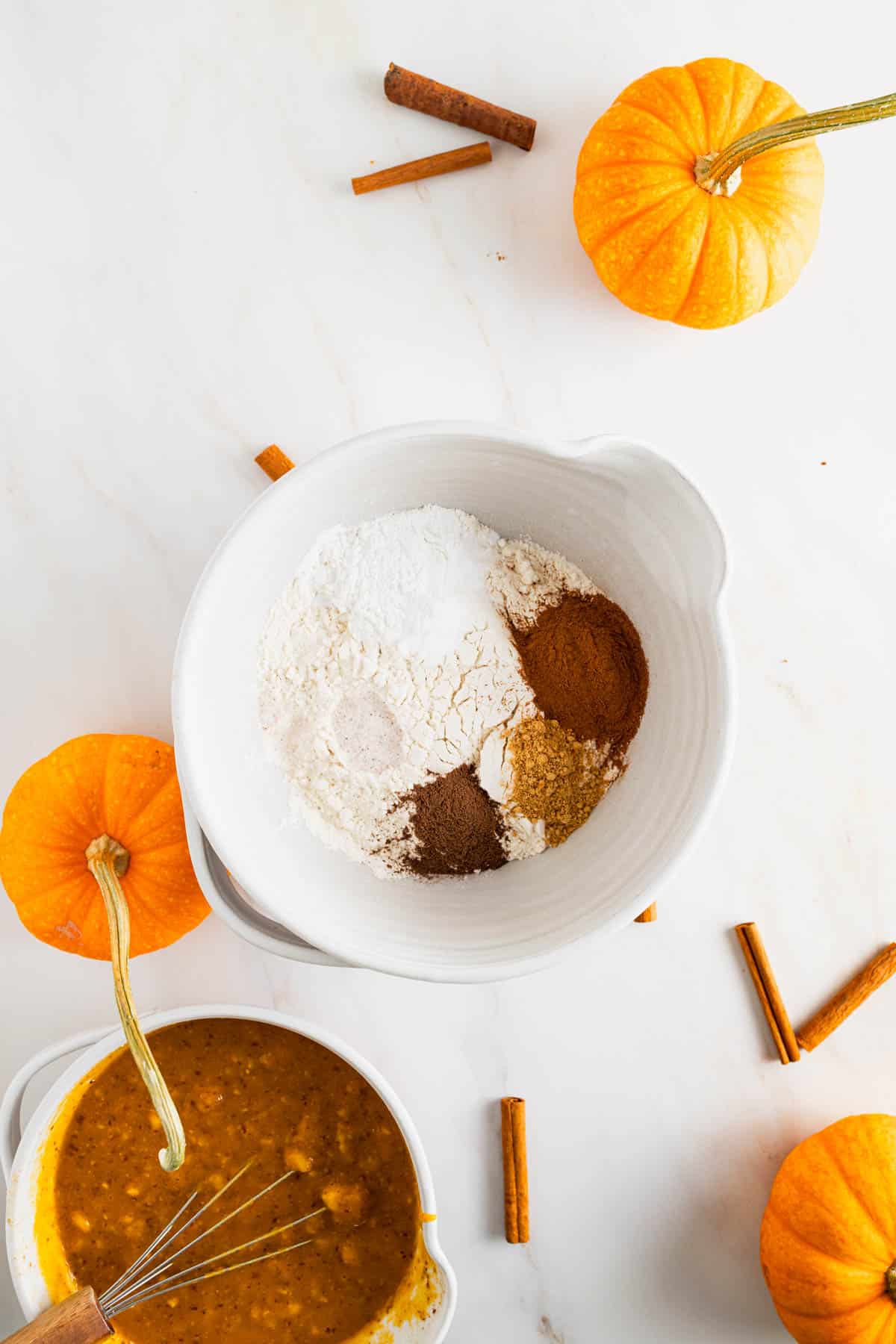 Dry muffin ingredients added to a large mixing bowl and stirred together.