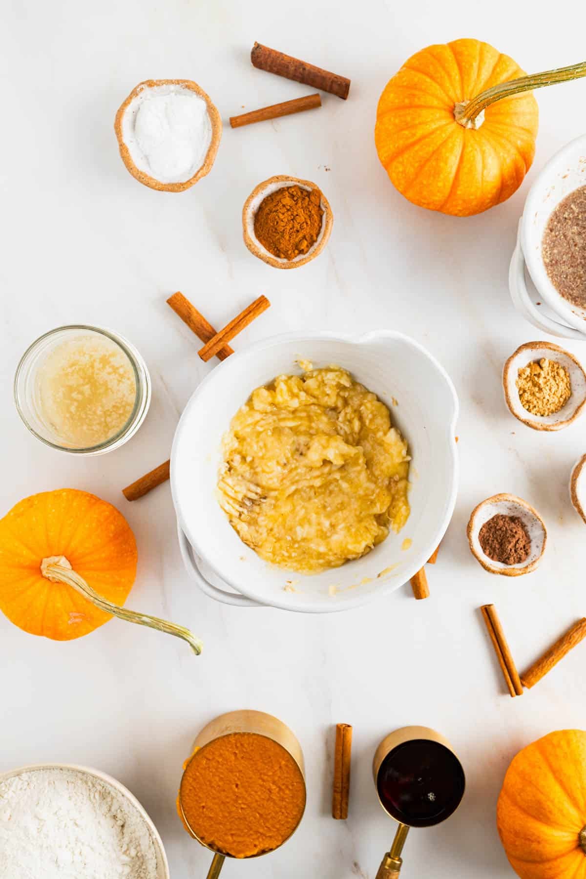 Banana in a mixing bowl getting mashed.