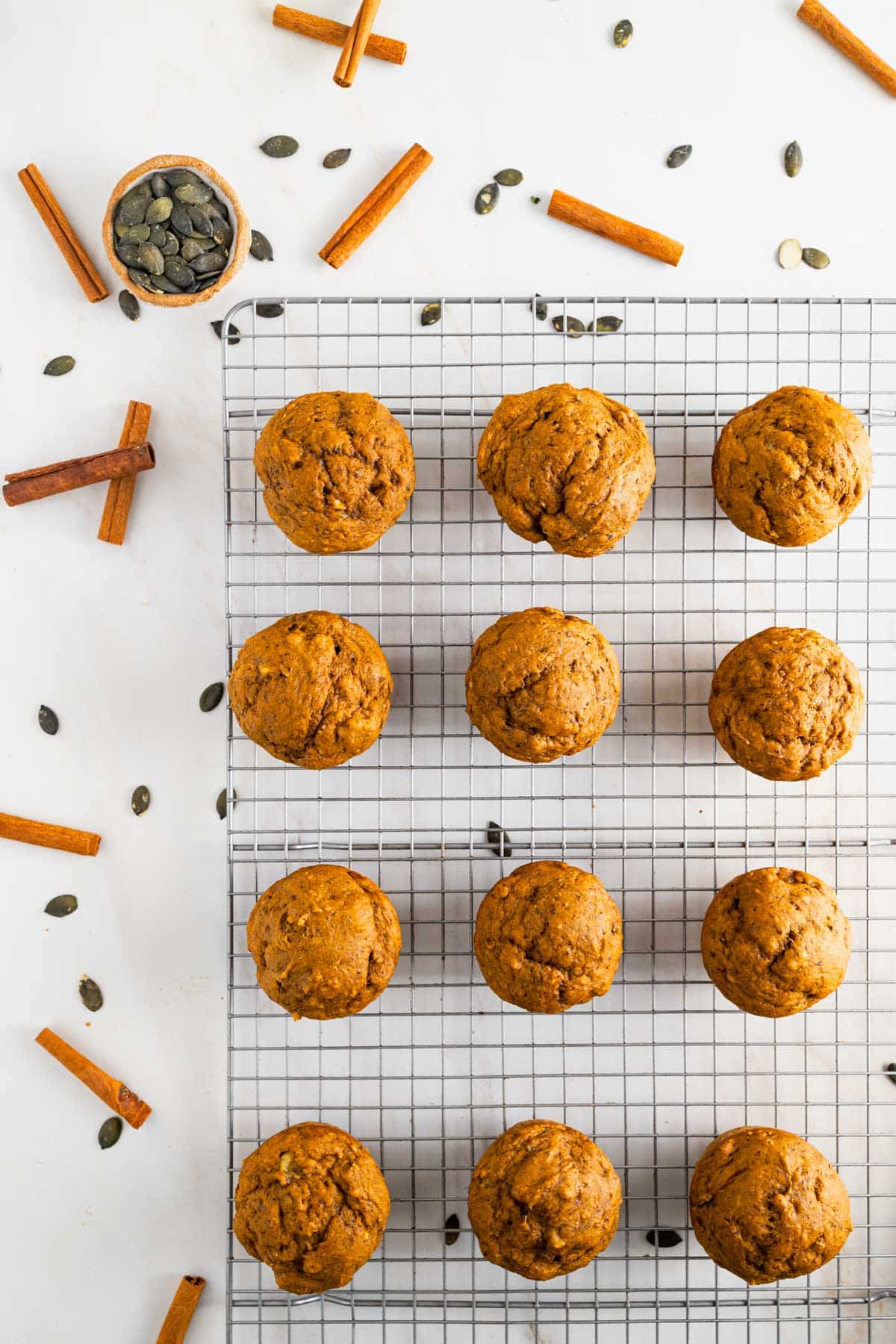 Baked muffins on a large cooling rack.
