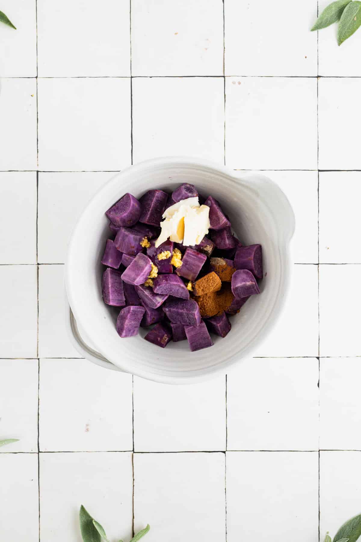 Ingredients for dairy free sweet potato casserole in a large mixing bowl.