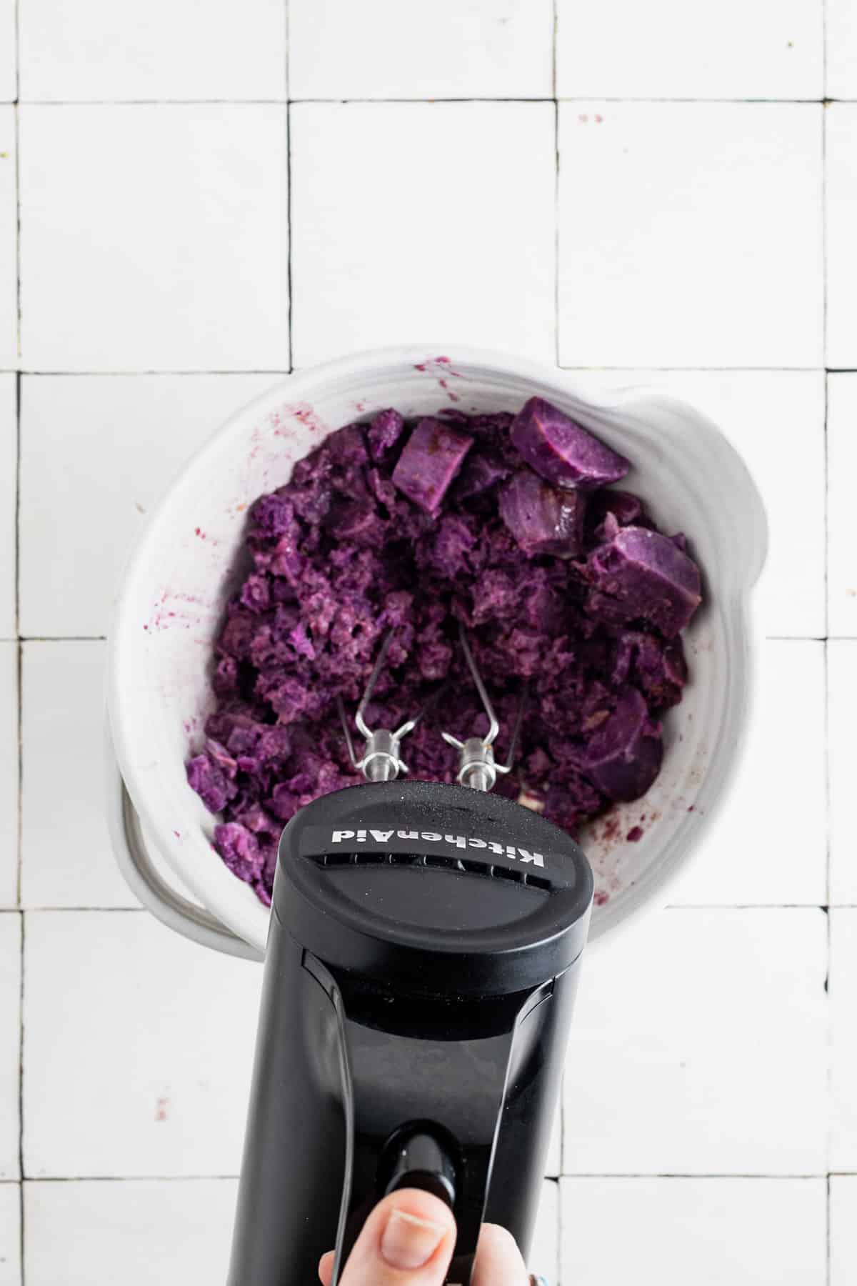 Whipping sweet potatoes with a hand mixer