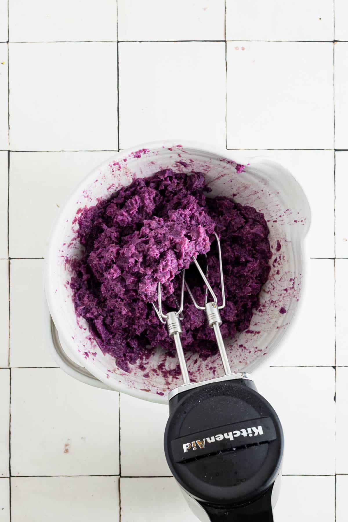 Whipping sweet potatoes with a hand mixer