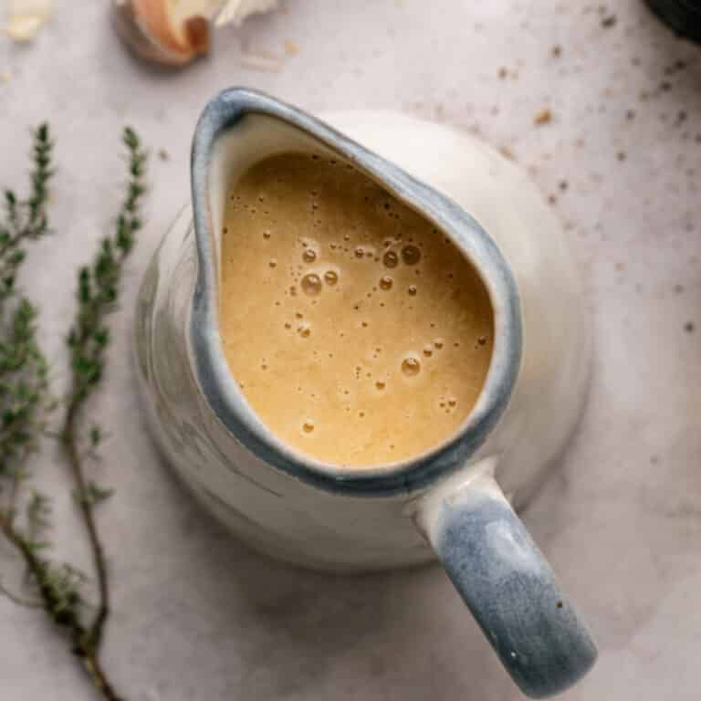 Vegan gravy in a ceramic gravy boat.