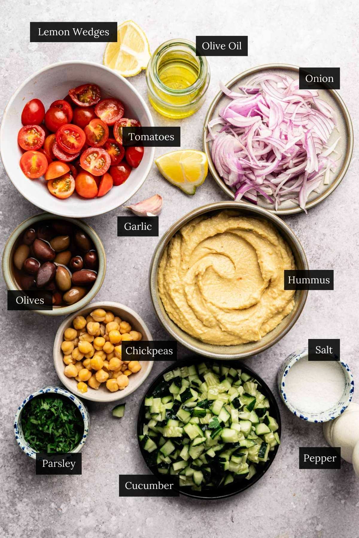 Ingredients for loaded hummus recipe with each ingredient labeled.