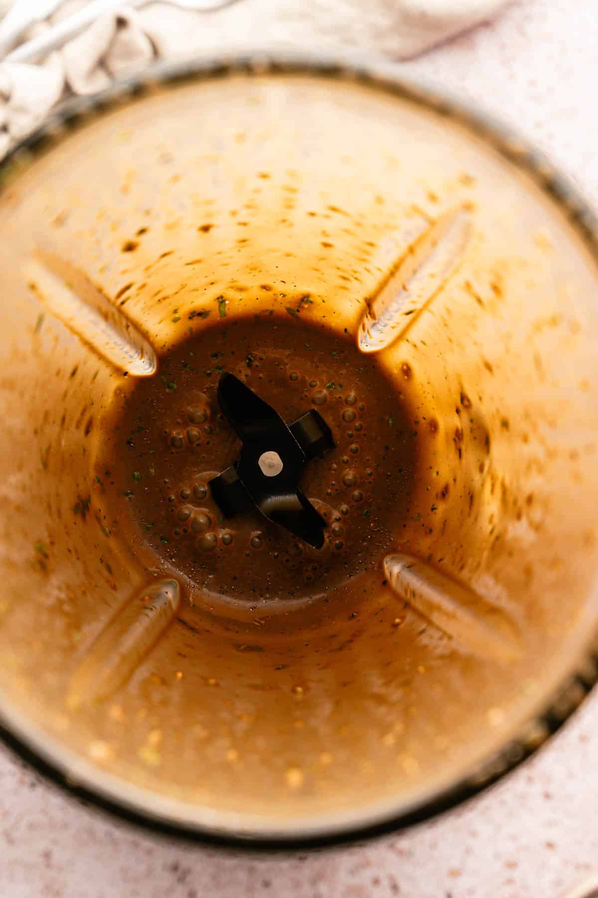 Step by step instructions for making basil balsamic vinaigrette.