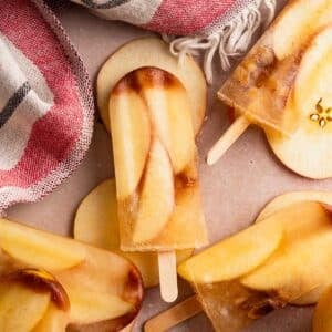 Close up of homemade apple cider popsicles.