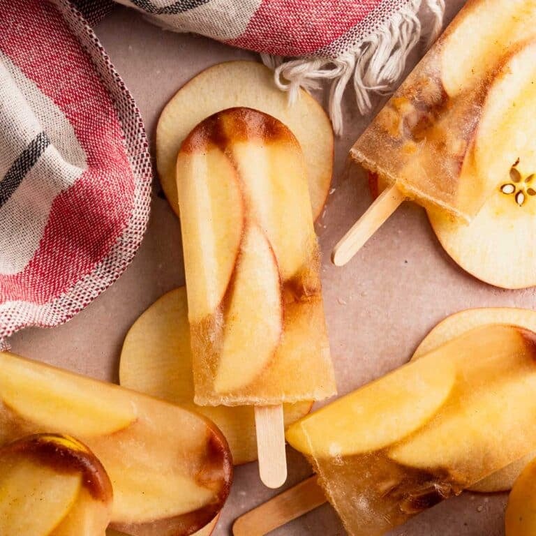 Close up of homemade apple cider popsicles.